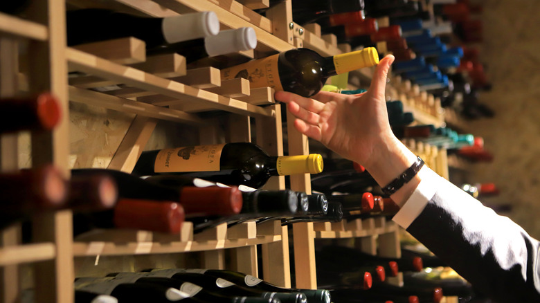 Sommelier with bottles of wine.