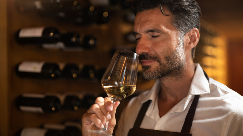 Sommelier with glass of wine