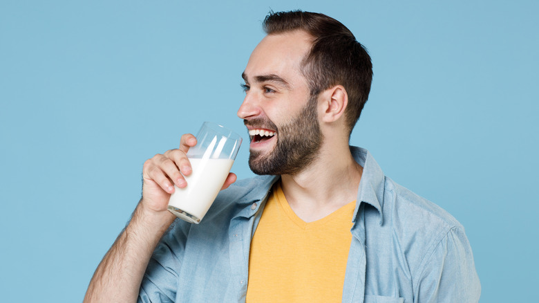 man drinking Almond milk