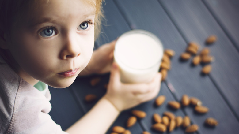 child with almond milk