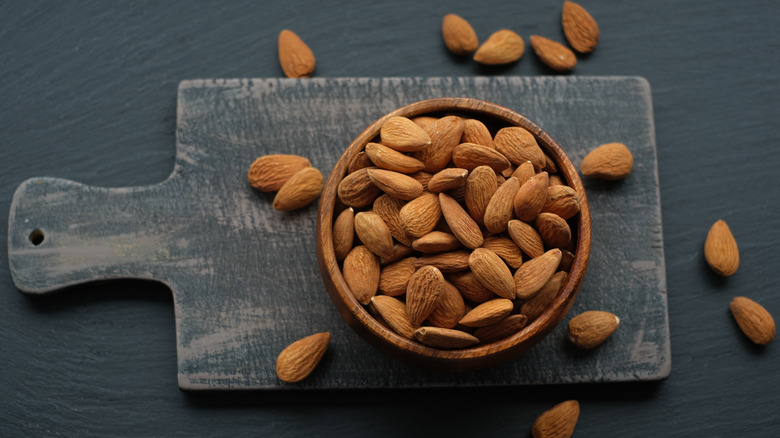 Almonds on a gray cutting board