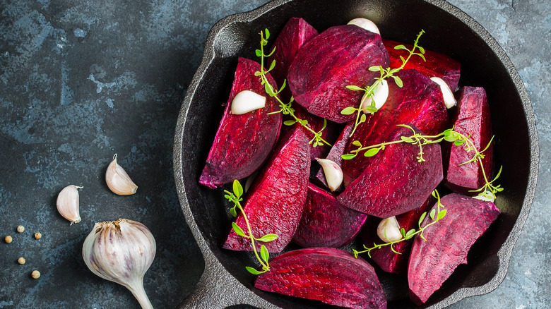 Beet wedges in cast iron pan with garlic