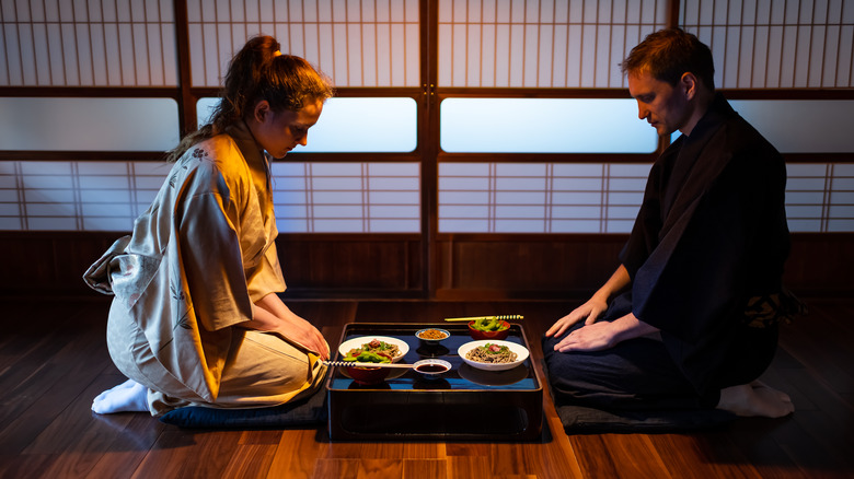 A couple sitting in a Japanese ryokan