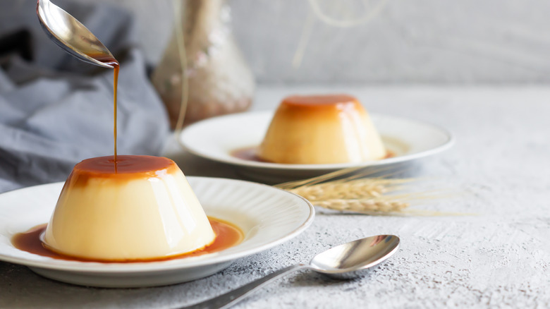 Caramel being poured onto flan