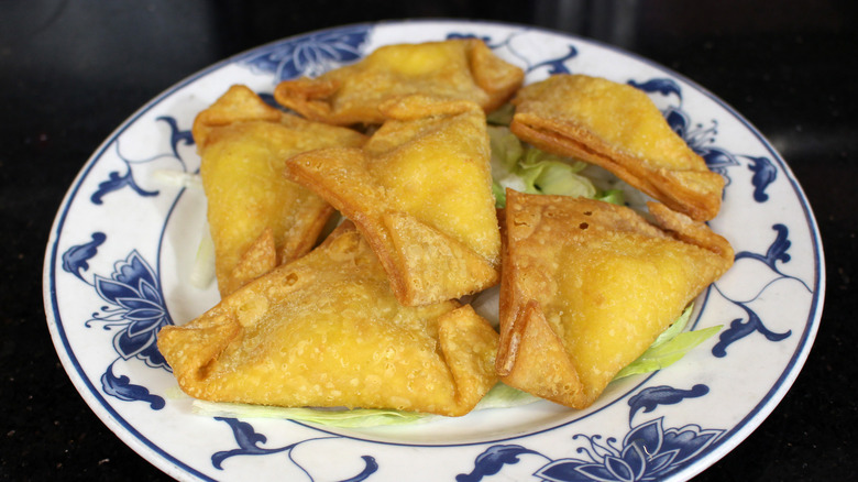 crab rangoons on a plate