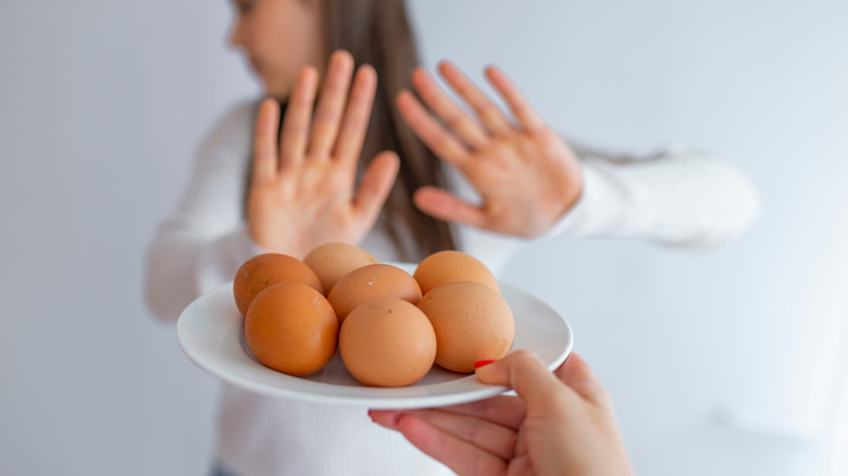 woman refusing eggs