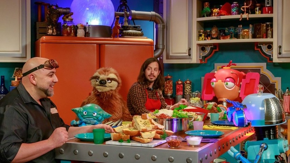 Duff, Geof, and puppets eating dinner 