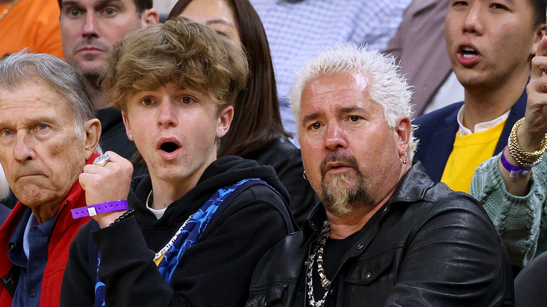 Ryder and Guy Fieri watching basketball