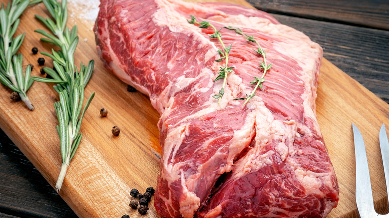 Raw hanger steak on cutting board