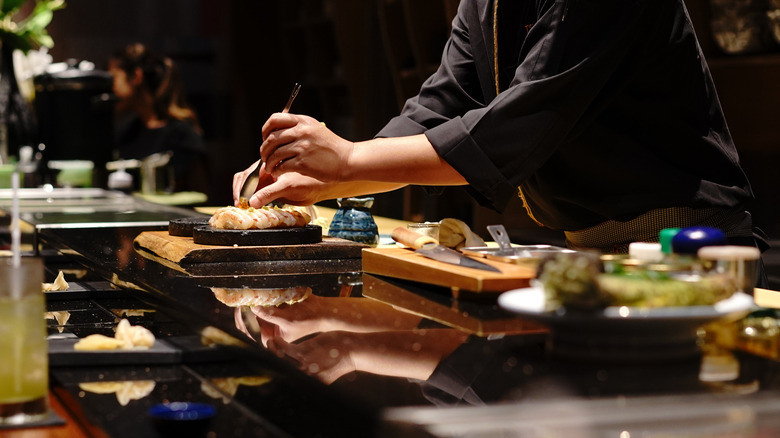 chef preparing sushi