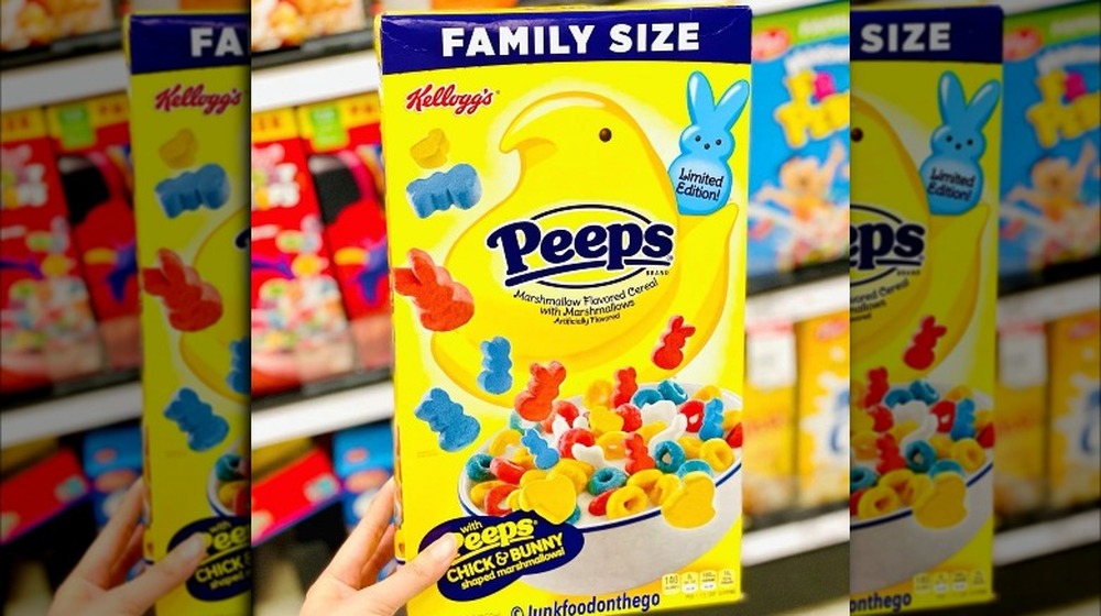 Someone holds Peeps cereal box
