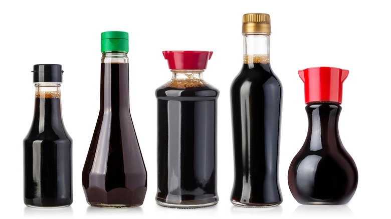 Soy sauce in bottles with different color caps