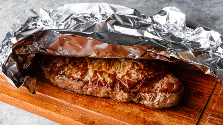 steak resting on board