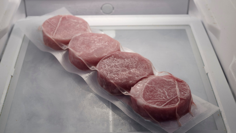 frozen steak in fridge