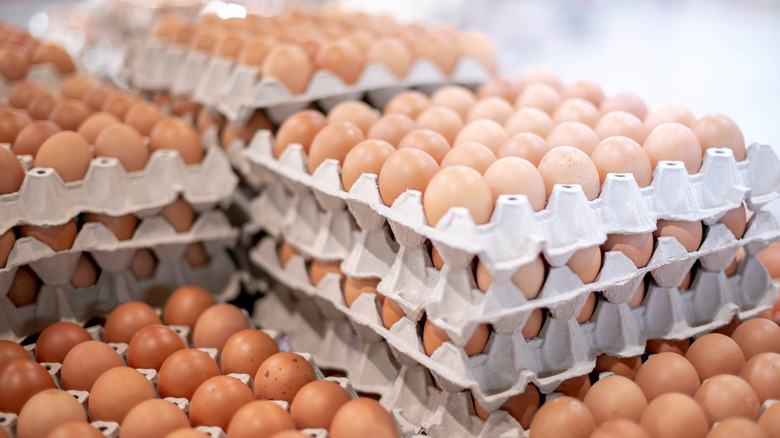 Stacks of eggs in brown cartons