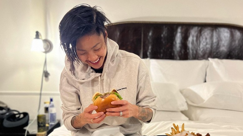 Kristen Kish eating a burger 