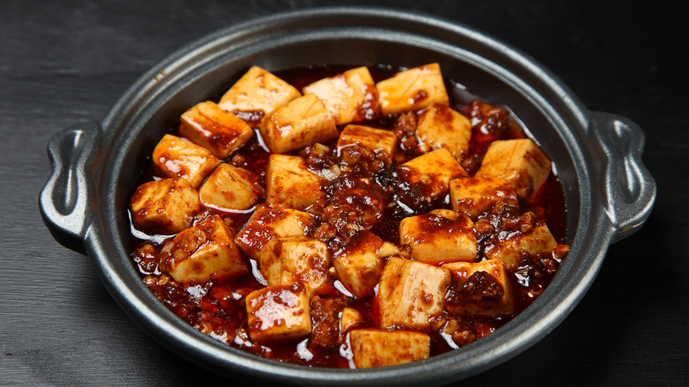 Mapo tofu in a black ceramic pot