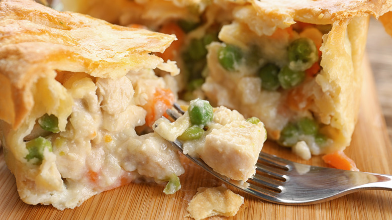 Chicken pot pie cut in half with fork