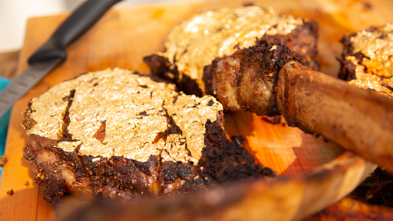 Gold encrusted tomahawk steaks