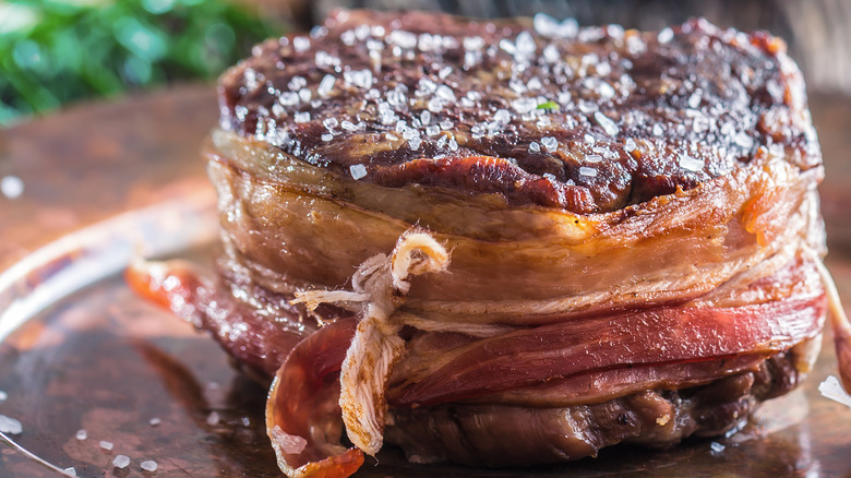 Filet mignon covered in salt and tied with string