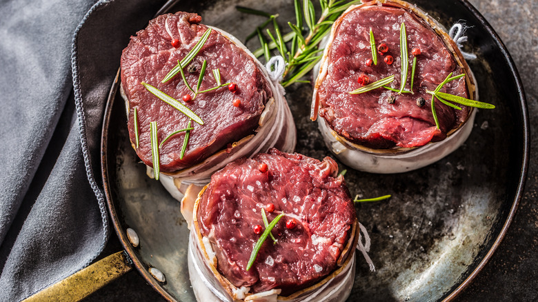 Tenderloin medallions arranged in pan