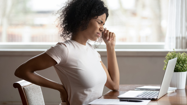 pained woman aching back