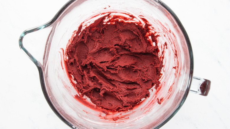 Red velvet cookie mixture in bowl