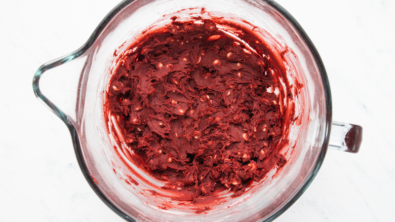 Red velvet cookie dough in mixing bowl