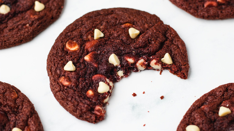 Red velvet cookie with bite taken out