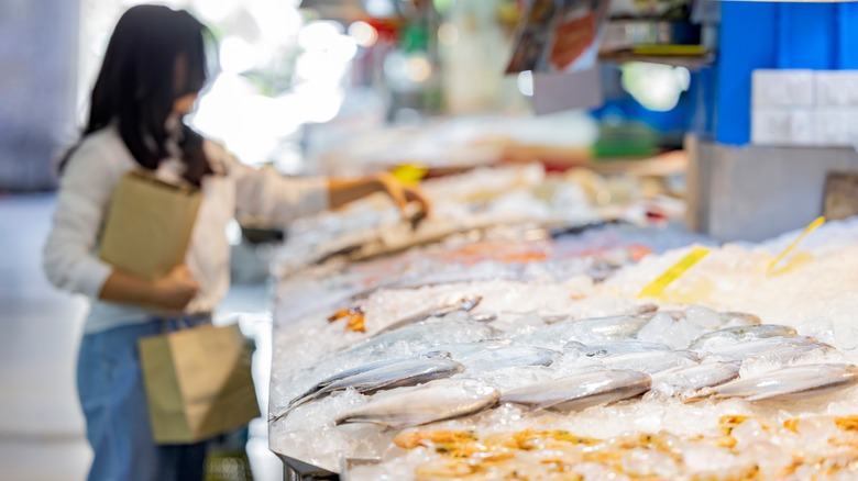 woman shopping for seafood