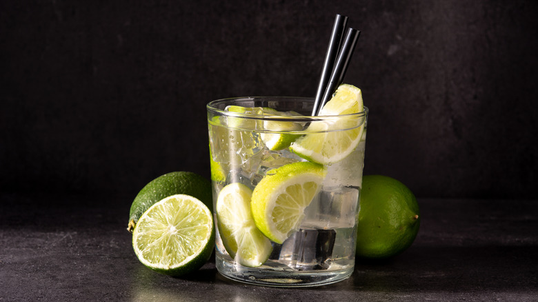 Caipiroska cocktail and limes