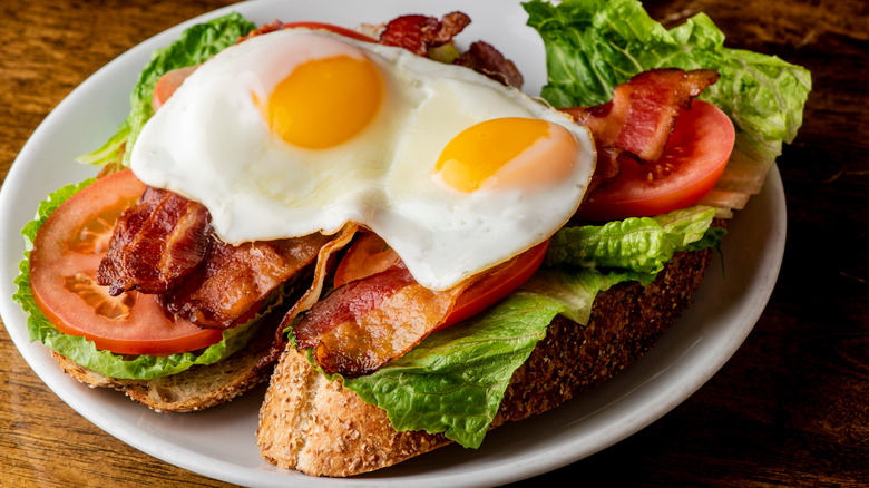 BLT sandwich with fried egg on top