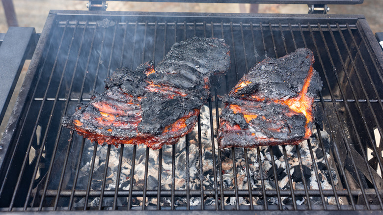 Burnt ribs on barbecue