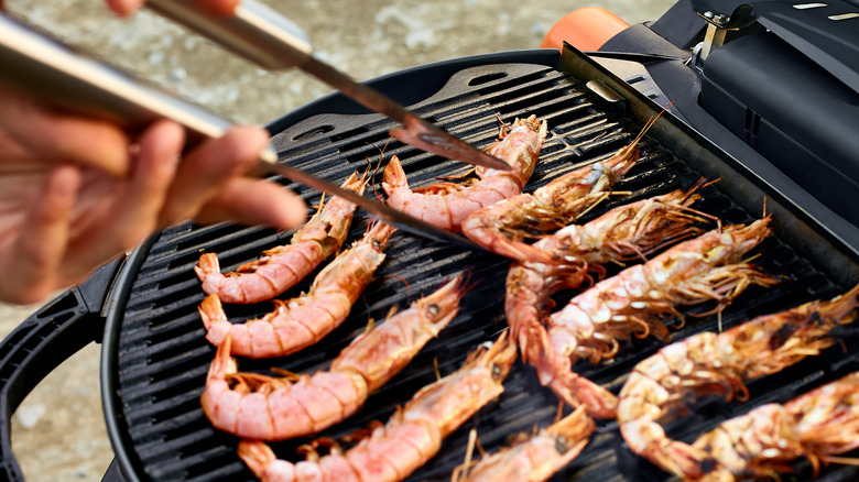 unpeeled colossal shrimp on grill