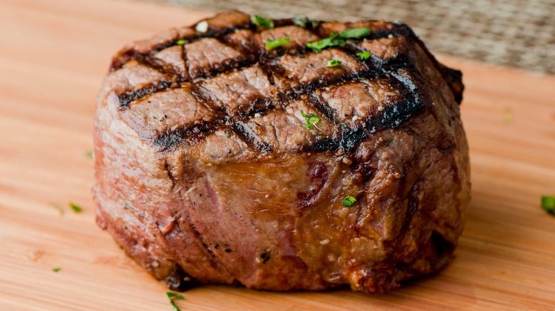 Grilled steak on cutting board