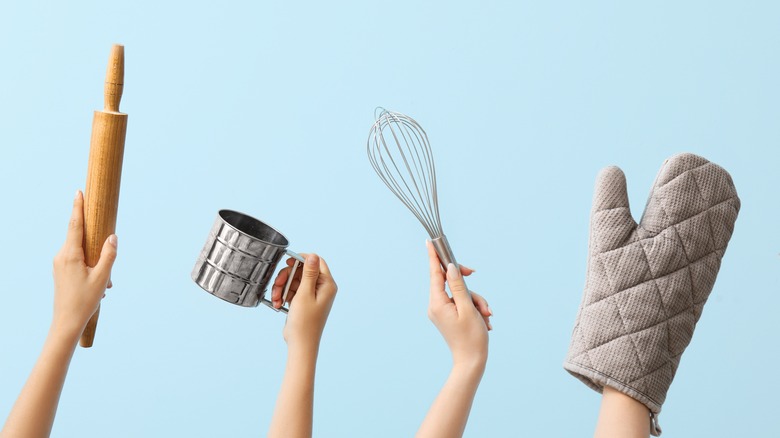 hands holding baking utensils