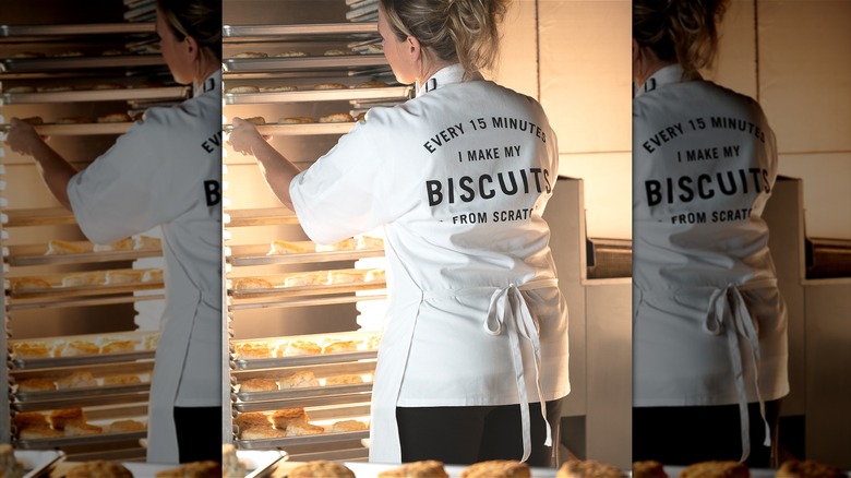 Employee with tray of biscuits