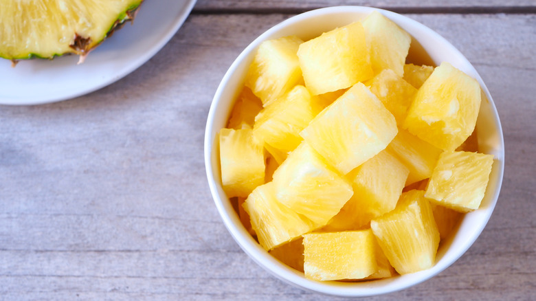 Pineapple chunks in bowl on table