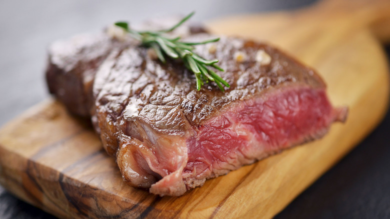 Blue steak on cutting board