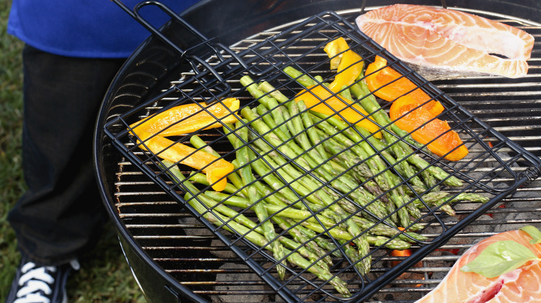 Grilling vegetables in grill basket