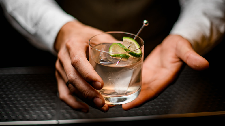 bartender holding vodka cocktail