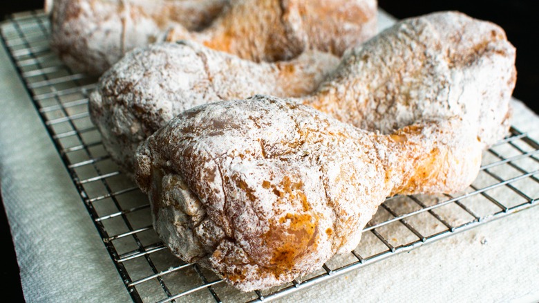 floured chicken on wire rack