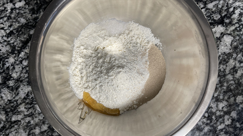 dough ingredients in stainless steel bowl