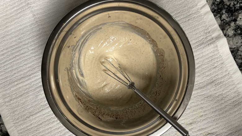 whisking chipotle lime mayo in bowl