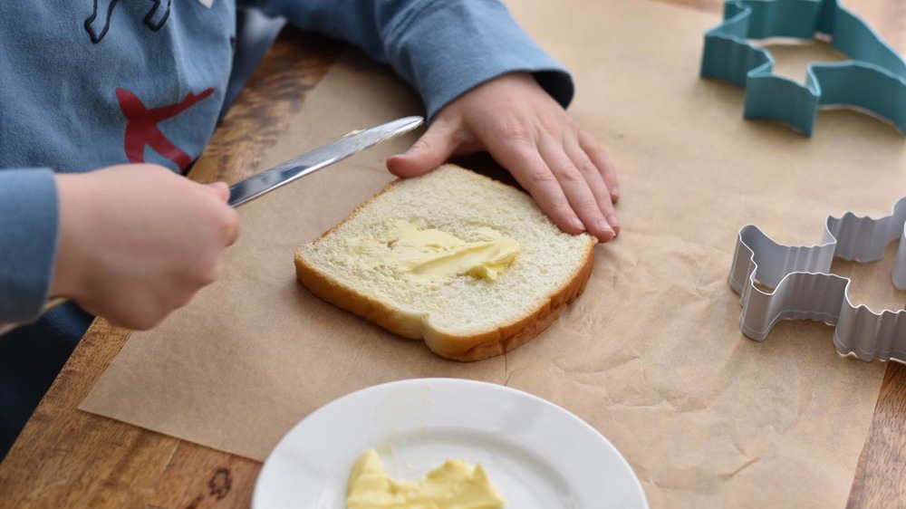 butter being spread for fairy bread