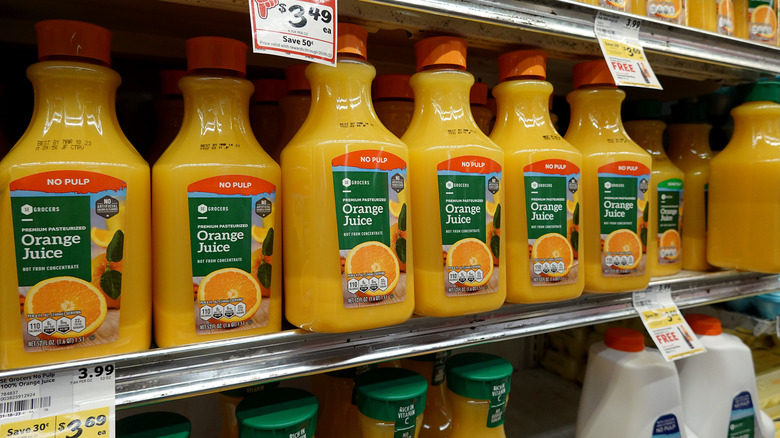 Orange juice bottles on shelf