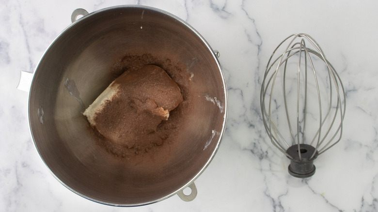 hot cocoa in bowl next to whisk