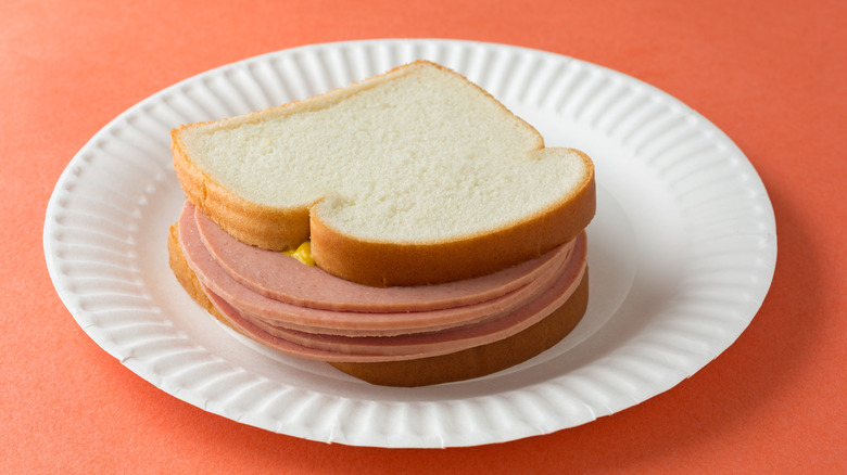 bologna sandwich on paper plate