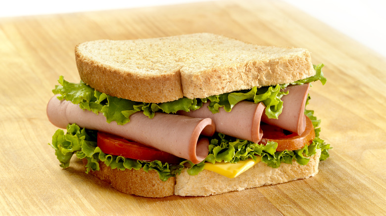 bologna sandwich on cutting board