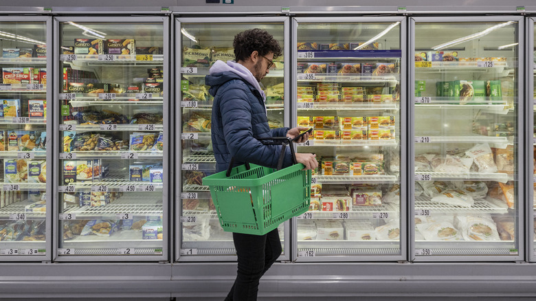 Man in frozen food aisle